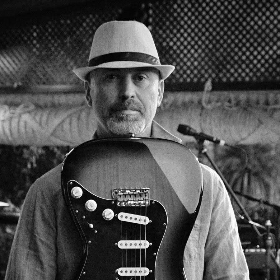 musician with guitar (Thomas Figueroa) Guitarist, Composer, Arranger, Songwriter, and Band Leader